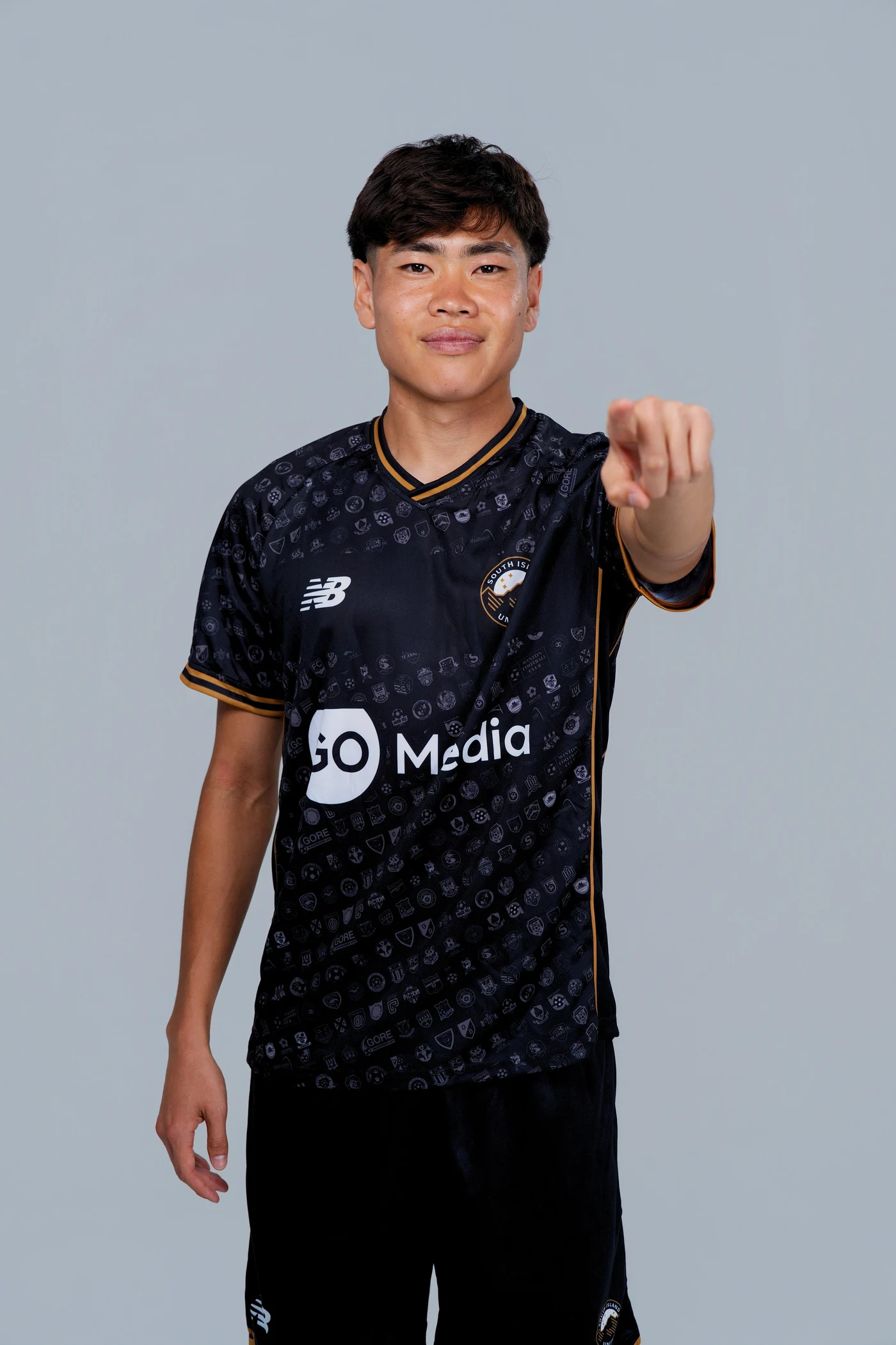 South Island United player pointing towards the viewer